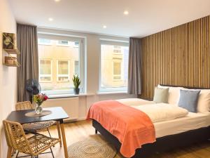 Ένα ή περισσότερα κρεβάτια σε δωμάτιο στο Lorenz Apartments