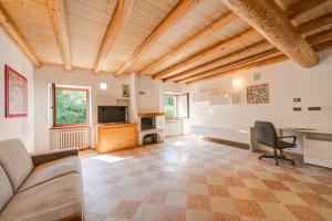 a living room with a couch and a table at Casa Mondragon In Lazise - Happy Rentals in Lazise