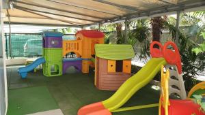 a childrens play area with a slide and a playground at Hotel Atlas in Cattolica +17 photos