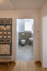 a bathroom with a toilet and a sink at mivida - Apartment Geierkogel in Hohentauern