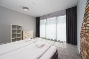 Кровать или кровати в номере Penthouse Comfort Apartments Granaria