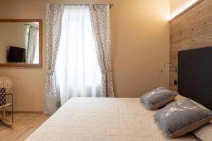 Postel nebo postele na pokoji v ubytování Hotel Pangrazzi - 3 stelle superior + 37 fotografií