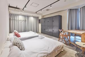 Postel nebo postele na pokoji v ubytování Tora Hotel Asakusa + 37 fotografií