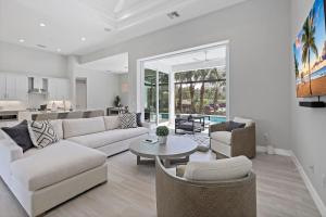 a living room with a couch and a table at 280 West Flamingo Circle in Marco Island