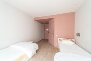 Cama o camas de una habitación en Adveniat Paris