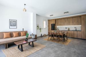 a living room with a couch and a table at Villa Tranquila Rhodes in Psinthos