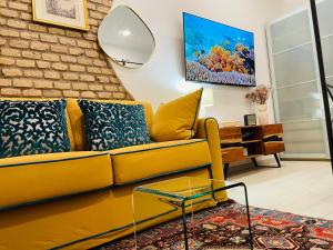 A television and/or entertainment centre at Colosseum-Apartments