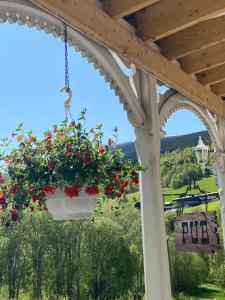 a view from a porch with flowers in a pot at Heidal Gjestgiveri AS in Nedre Heidal