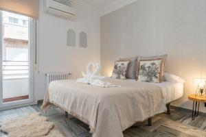 Postel nebo postele na pokoji v ubytování tuGuest Gran Vía 24 Apartment