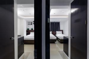 Postel nebo postele na pokoji v ubytování Nest Nano Suites Poblacion - Makati