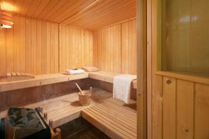 a wooden sauna with two benches and a towel at Residence Pietre d'Istria - with private service in Burići