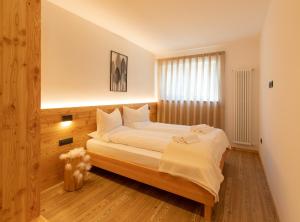 Posteľ alebo postele v izbe v ubytovaní Brenta Rosso - Charme Apartments