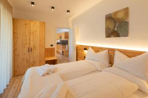 Posteľ alebo postele v izbe v ubytovaní Brenta Rosso - Charme Apartments