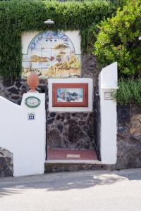 a door to a building with a picture on it at Hotel Don Felipe in Ischia