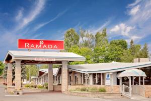 a sign for a rambala gas station at Ramada by Wyndham Gananoque Provincial Inn in Gananoque