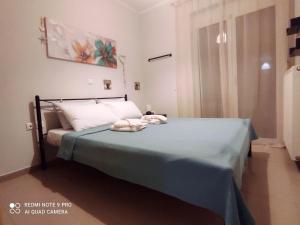 Postel nebo postele na pokoji v ubytování Nafplio BREEZE Άνετη διώροφη κατοικία από 4 έως 9 επισκέπτες