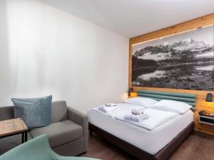 Postel nebo postele na pokoji v ubytování Mercure Hotel Garmisch Partenkirchen