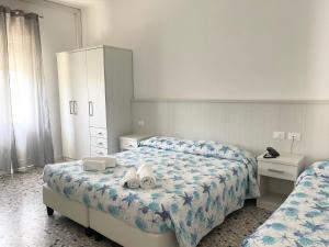 Voodi või voodid majutusasutuse Hotel Vianello toas