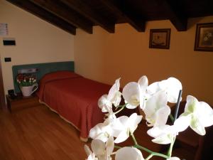 Postel nebo postele na pokoji v ubytování Hotel Villa Monica