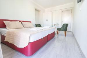 Postel nebo postele na pokoji v ubytování YAŞAM HOTEL
