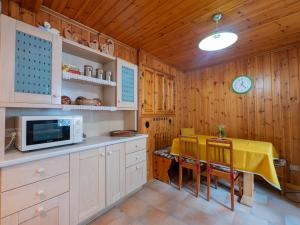 a kitchen with a table with a yellow table cloth on it at I Host Apartment - Centrale 16 in Piatta