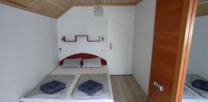 Postel nebo postele na pokoji v ubytování Timbi Vendégház