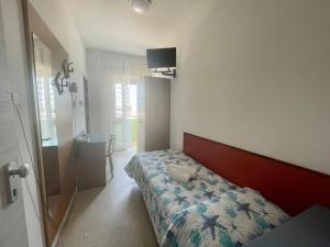 Voodi või voodid majutusasutuse Hotel Vianello toas