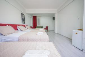 Postel nebo postele na pokoji v ubytování YAŞAM HOTEL