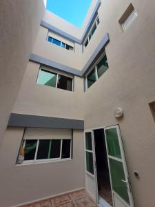 a view from the outside of a house at Appart Clim Wifi 700m de la Plage in Saïdia