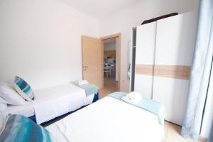 A bed or beds in a room at The Olive Garden-Almyrida