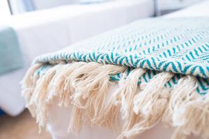 A bed or beds in a room at The Olive Garden-Almyrida