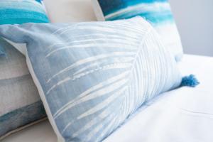 A bed or beds in a room at The Olive Garden-Almyrida