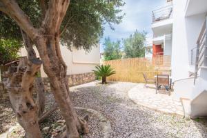 A garden outside The Olive Garden-Almyrida