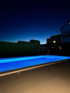 Bazén v ubytovaní Apartments Villa Ohana alebo v jeho blízkosti
