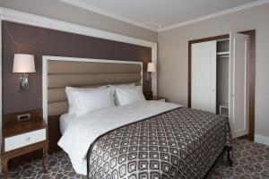 Postel nebo postele na pokoji v ubytování ALUSSO THERMAL HOTEL SPA