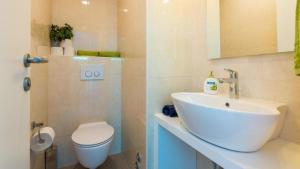 a bathroom with a sink and a toilet at Top Hill Premium Apartment in Dubrovnik