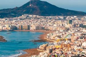 a view of a city with a beach and a mountain at 3 bedrooms apartement with wifi at Las Palmas de Gran Canaria in Las Palmas de Gran Canaria