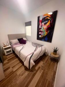 En eller flere senge i et værelse på Spacious Apartment in Las Palmas 80 m² with Air Conditioning