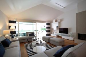 a living room with a couch and a table at Luxury villa Lara with private pool in Banjole