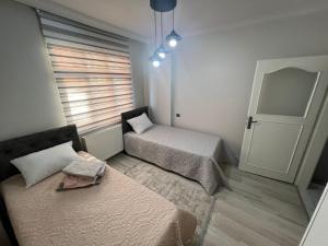 Postel nebo postele na pokoji v ubytování Hk Apart Trabzon