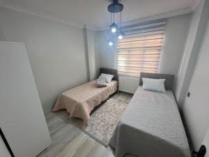 Postel nebo postele na pokoji v ubytování Hk Apart Trabzon