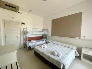 Voodi või voodid majutusasutuse Hotel Vianello toas