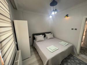 Postel nebo postele na pokoji v ubytování Hk Apart Trabzon