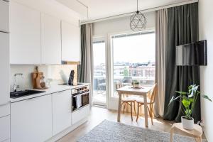Kuchyň nebo kuchyňský kout v ubytování Arctic Taiga Penthouse City Suite