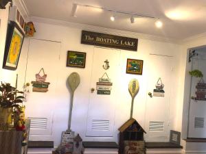 a white wall with a sign that says the bowling lanes at Madie's Place Bed & Breakfast in Santa Rosa, Laguna near Enchanted Kingdom in Santa Rosa