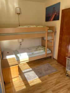 a bunk bed room with two bunk beds in it at Ferienwohnung Rosengarten am Manötscherhof in Cornedo all'Isarco