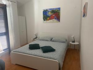 Posteľ alebo postele v izbe v ubytovaní Giorgio Funtana