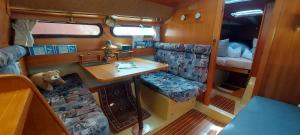 an interior view of an rv with a table and a couch at Gasthaus Ammertalerhof in Saulgrub