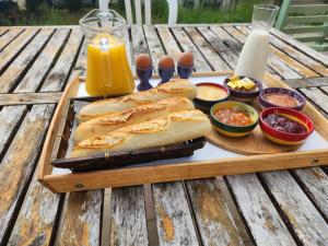 a tray of bread and other food on a table at Studio Indépendant Douceur Provençale in Montagnac