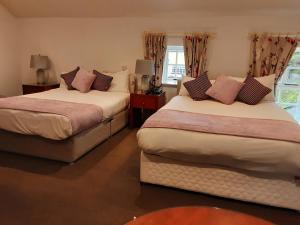 Letto o letti in una camera di Leixlip Manor Hotel